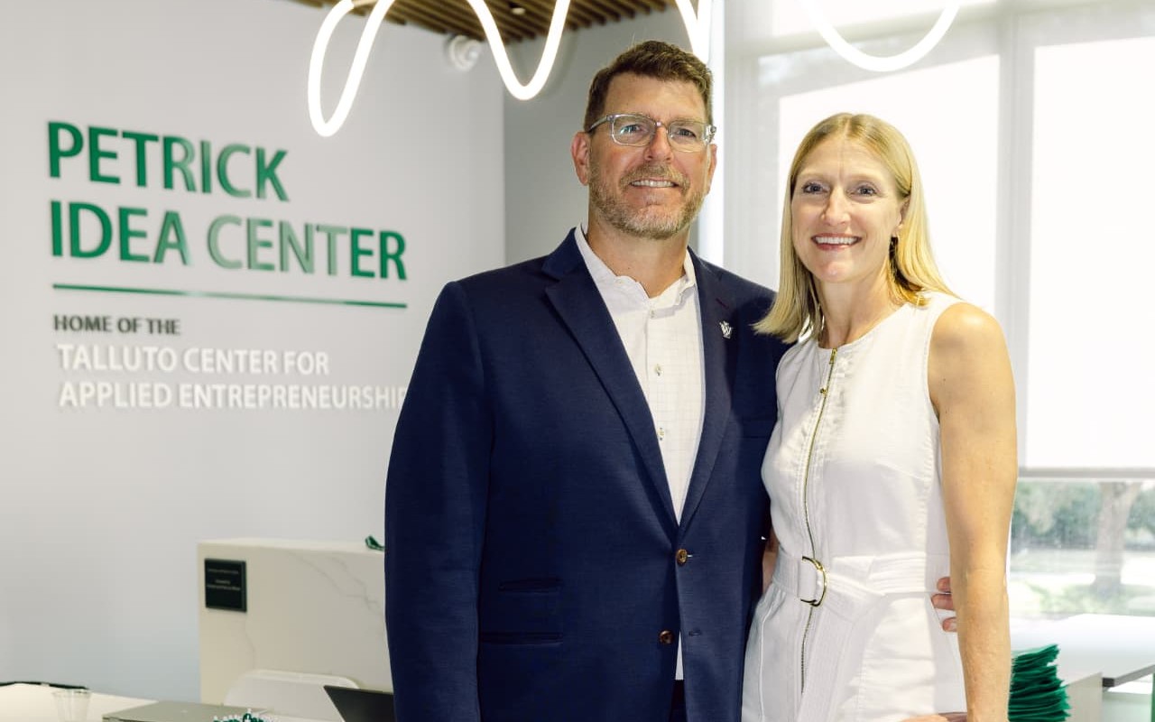 Marc and Noel Talluto in front of the Petrick Idea Center sign, home of the Talluto Center for Applied Entrepreneurship