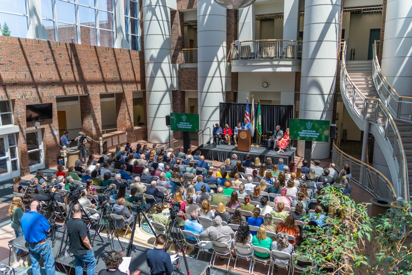 A large crowd gathered in a campus atrium for the Fisher Center announcement
