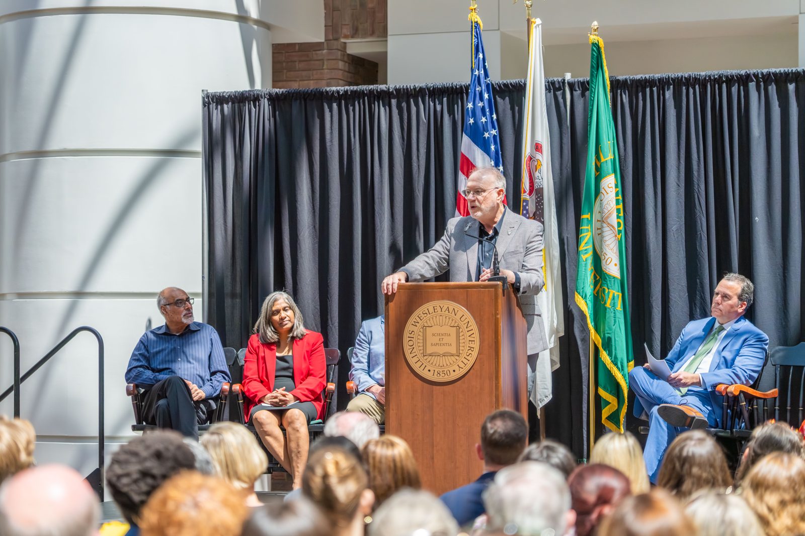 A speaker at the podium during the Fisher Center celebration